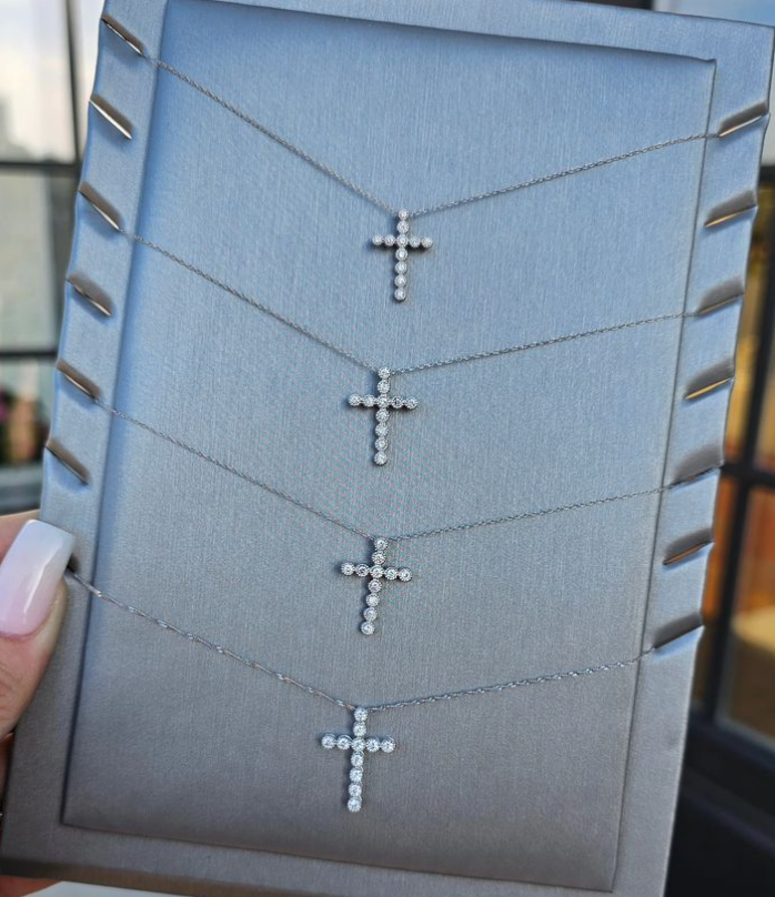 Diamond cross necklaces in varying sizes, available at Custom Jewelry in Southaven, MS